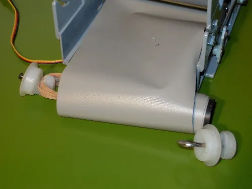 Avvolgitore del nastro con all'interno elastico che lavora per torsione